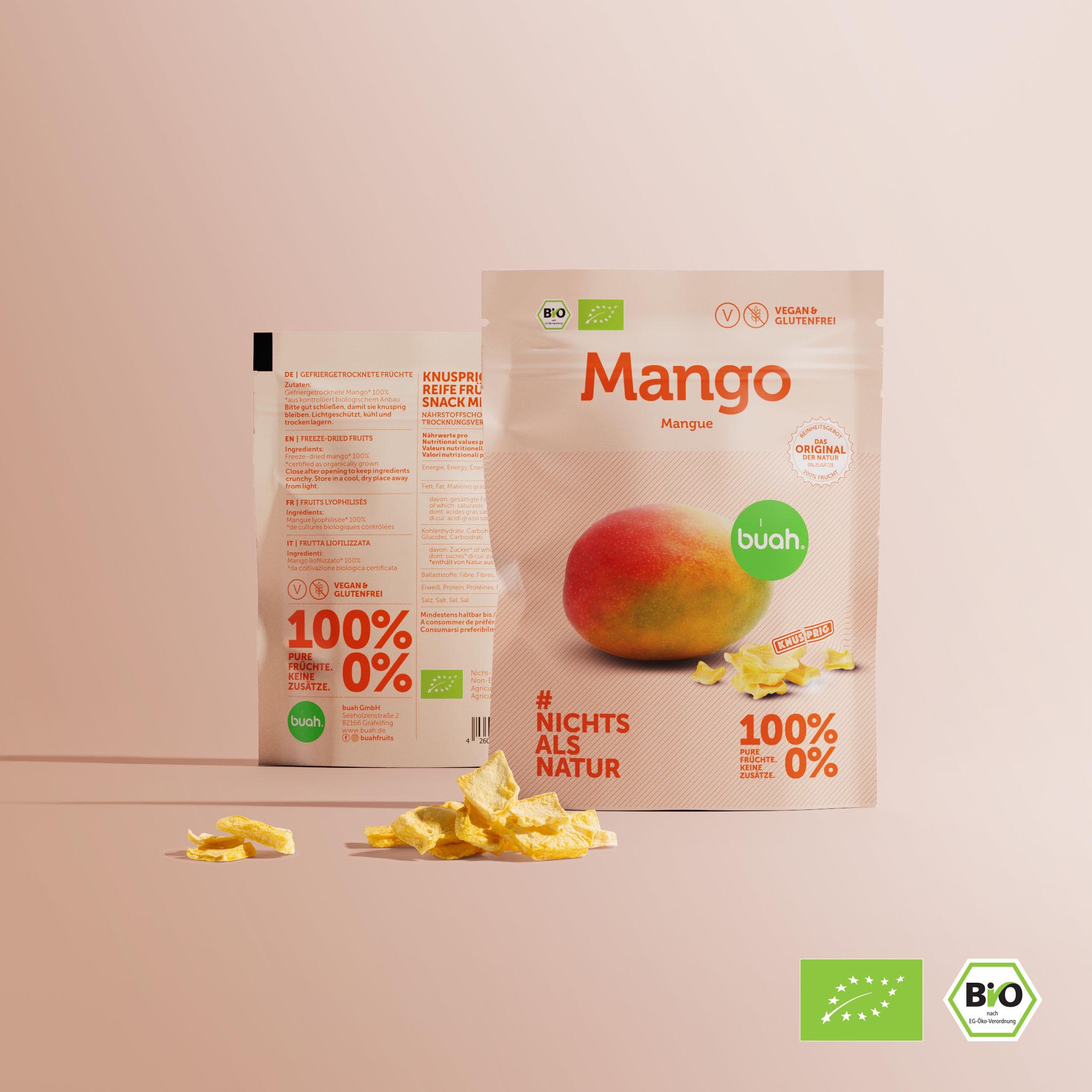 buah mango liofilizzato nel Confezione monodose con un mucchietto di mango liofilizzato in primo piano