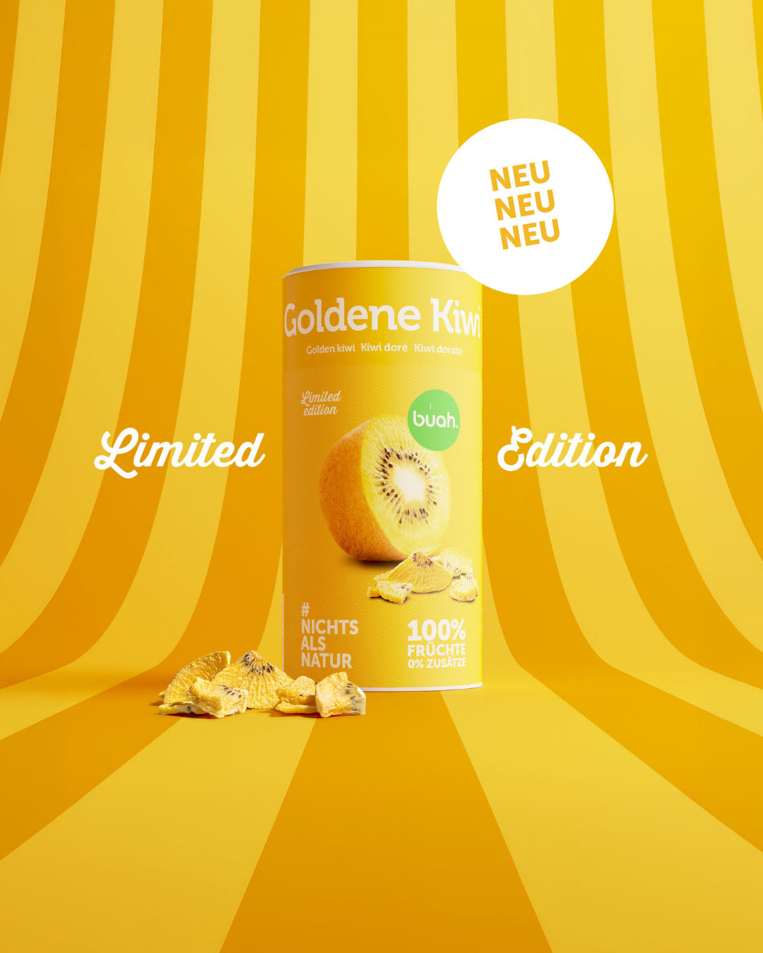 Eine Dose buah gefriergetrocknete Goldene Kiwi steht mit knusprigen Fruchtstücken auf einem gelb-orange gestreiften Hintergrund. Flankiert wird sie vom Schriftzug „Limited Edition“. Oben rechts steht in einer weißen Blase „NEU NEU NEU“.