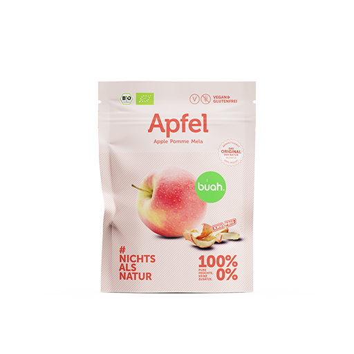 buah Snackpack vakuumgetrockneter Apfel vor rosa Hintergrund