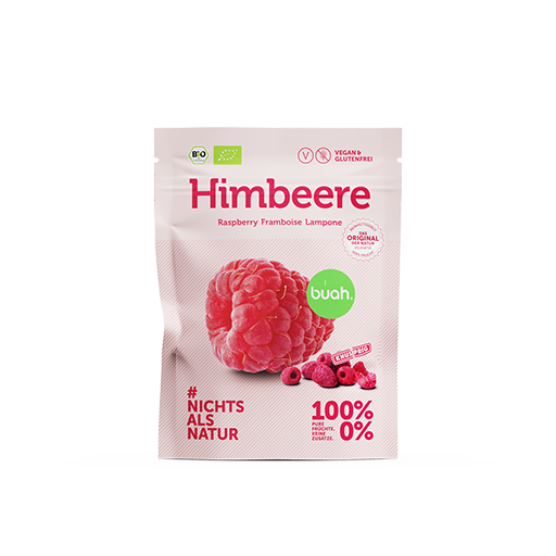 Zwei buah Snackpacks stehen nebeneinander mit gefriergetrockneten Himbeeren vor rosa Hintergrund